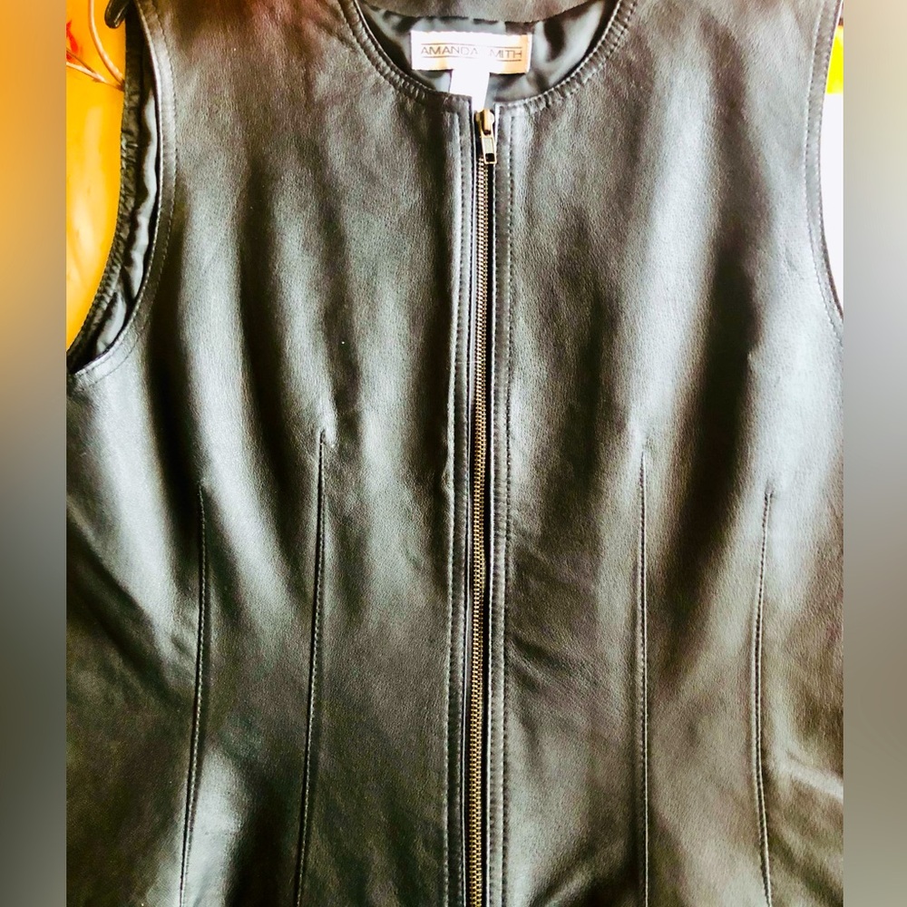 Amanda Smith Genuine Leather Vest. 
Black Leather, Satin Lining .
Size 12
Nice!